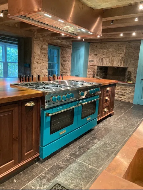 Luxury kitchen with turquoise professional range