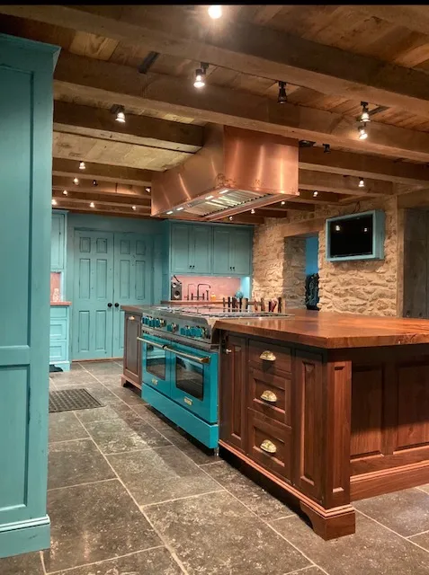 Kitchen island with copper range hood