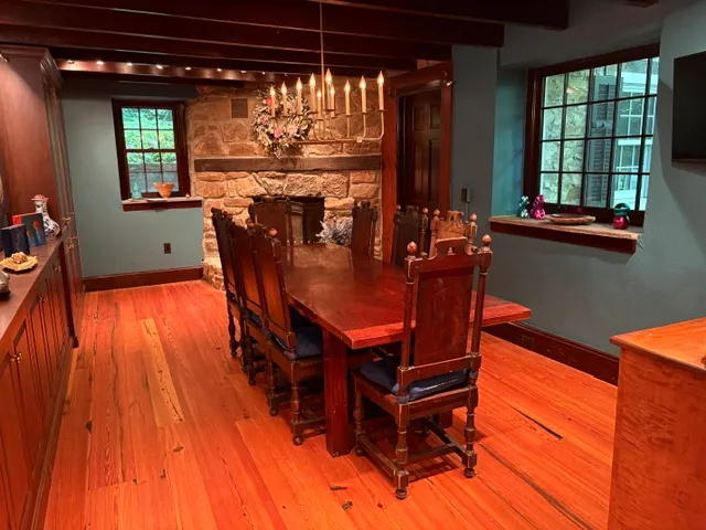 Formal dining room with stone fireplace